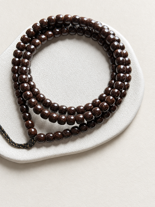 Coconut Calyx Strand, 108 Barrel Beads — another angle
