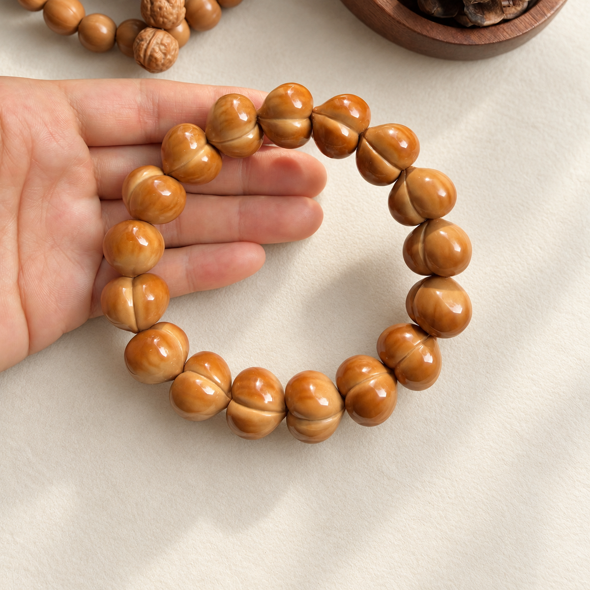 Monkey Head Walnut Bracelet, Glossy Peach Beads — detail view