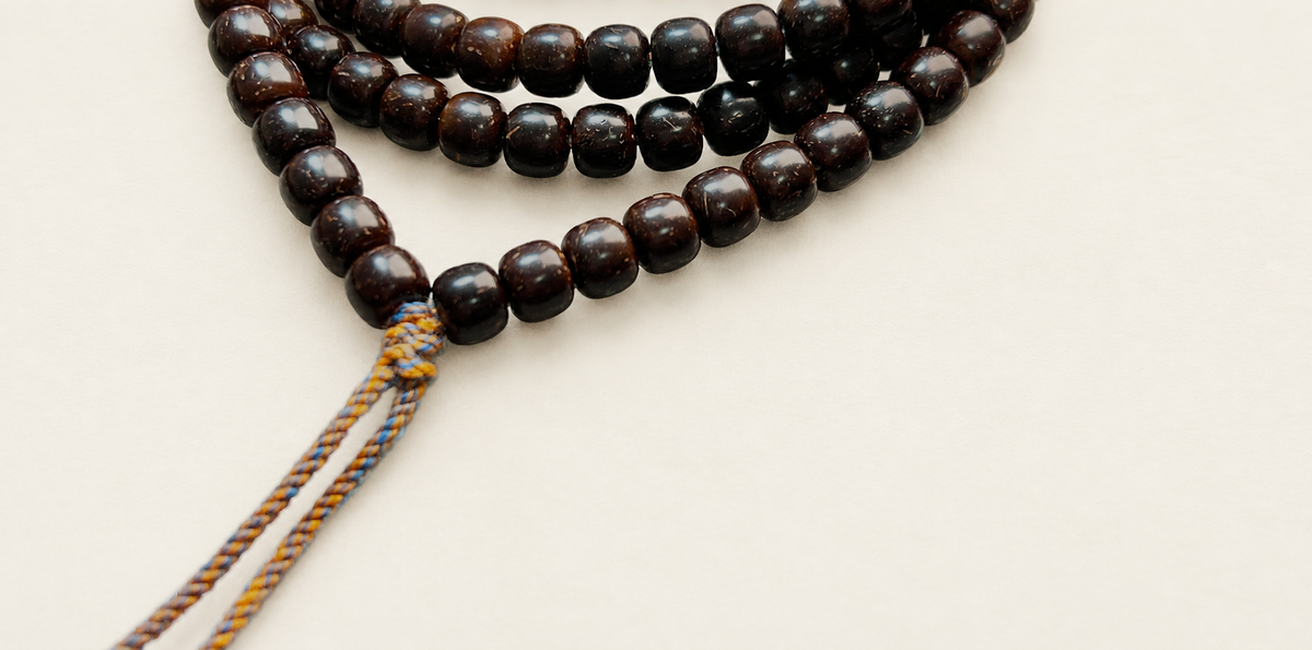 Coconut Calyx Strand, 108 Barrel Beads — detail view