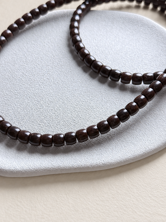 Coconut Calyx Strand, 108 Small Barrel Beads — another angle