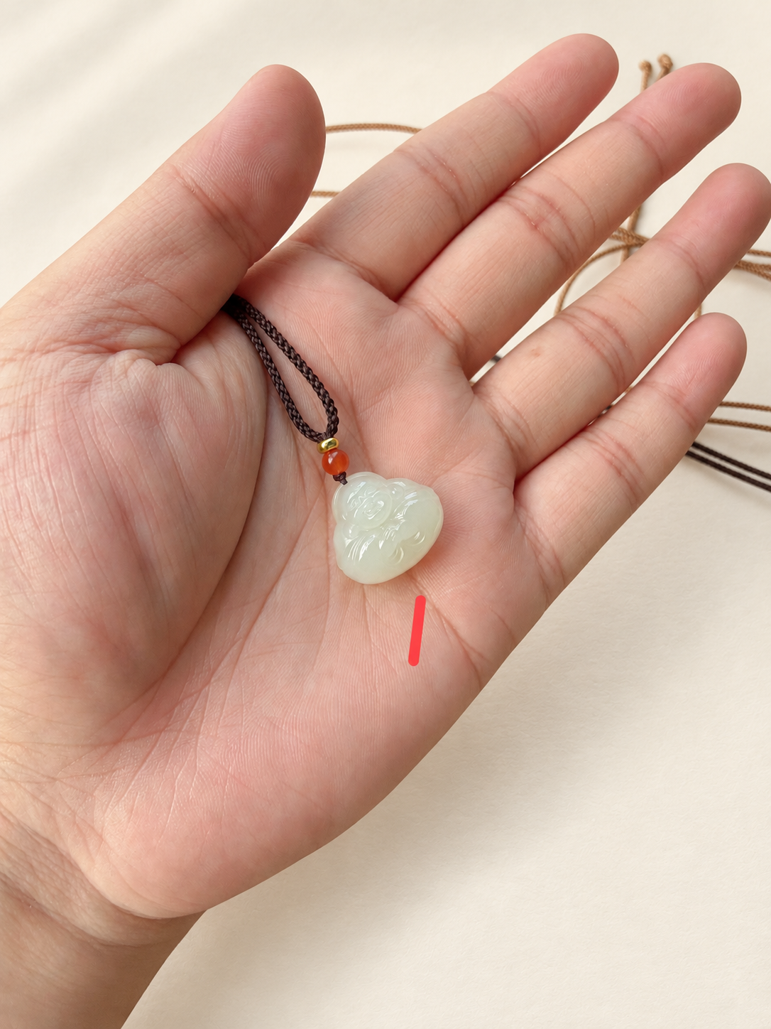 Nephrite Jade Pendant, Small Buddha — detail view