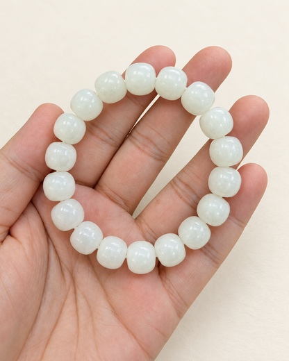 White jade bracelet with rounded barrel beads