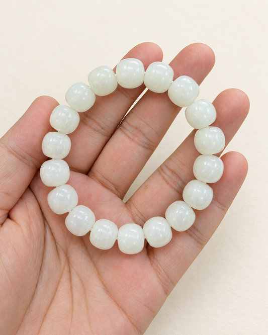 White jade bracelet with rounded barrel beads